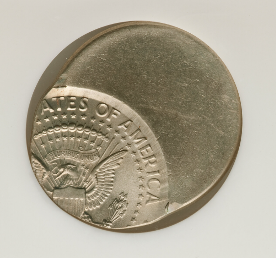 2011 Kennedy half dollar off-center strike error showing design shifted from center of planchet
