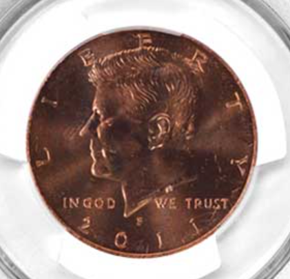 2011 Kennedy half dollar missing clad layer error showing reddish copper core exposed on one face
